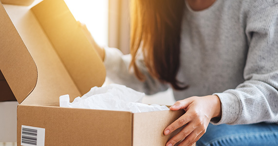 happy customer receiving customer appreciation gift